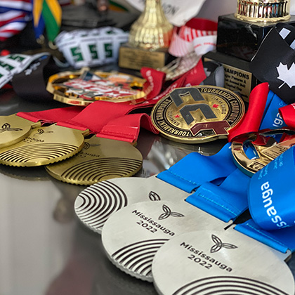 closeup of three silver medals amongst others