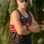 young man in sunglasses with arms crossed