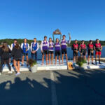 multiple athletes standing on awards podium