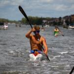 young man paddling a kayak