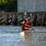 young man paddling a kayak